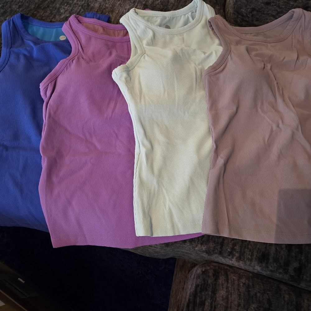 4 Compression Ribbed Sleeveless Tops 1 Free